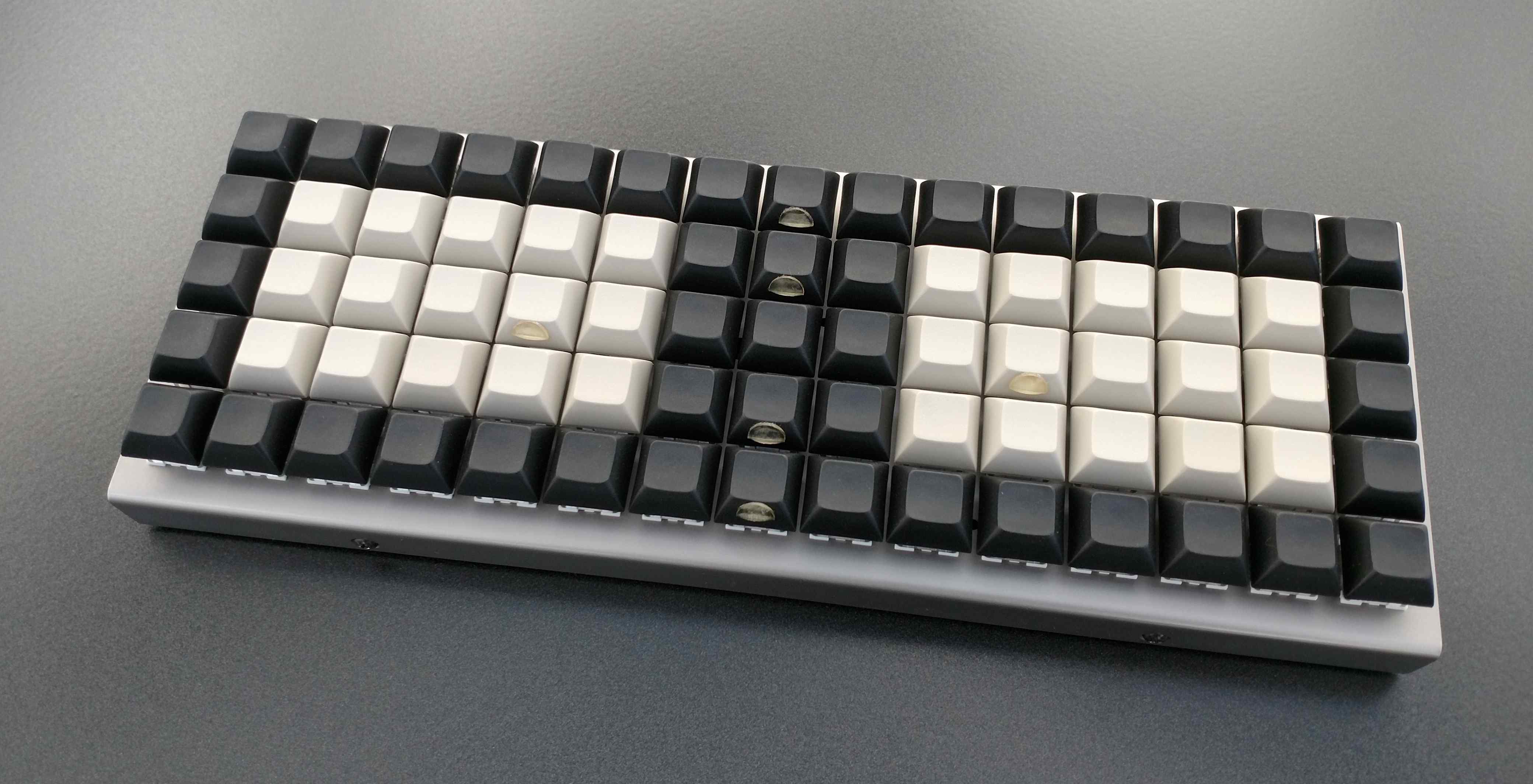 XD75 with DSA keycaps featuring 75 keys in a grid layout and a stainless steel case